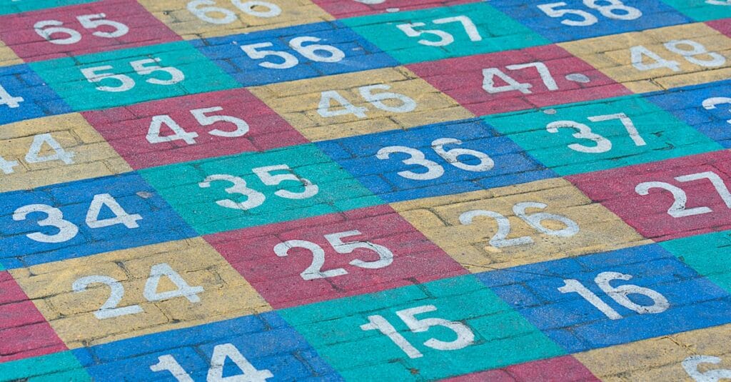 Vibrant numbered grid on a concrete surface outdoors. Perfect for educational materials.