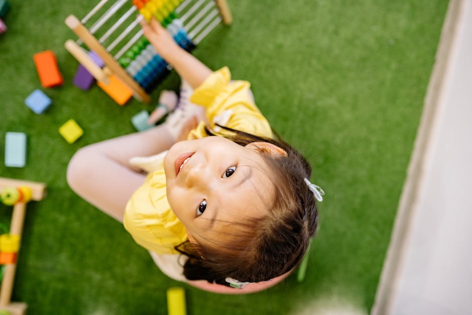 Happy child playing with abacus indoors. Perfect for educational and playful themes.