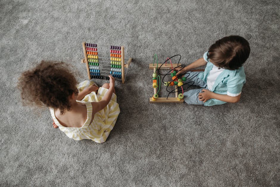 Two children enjoy educational play with a colorful abacus and wooden toy.