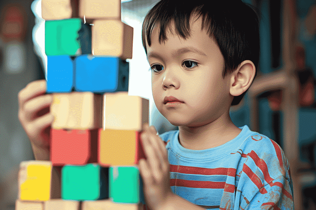 Terapi Calistung - Anak yang sedang menyusun block berwarna