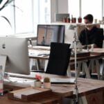 Open-plan office with modern decor and natural lighting, ideal for productivity.