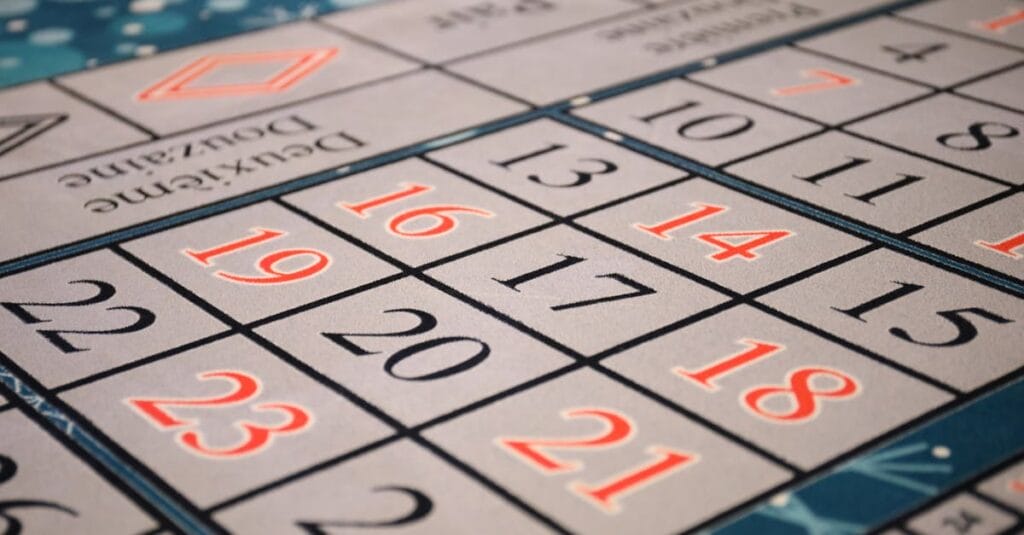 Vibrant close-up of a numbered board game layout with a focus on various numbers and patterns.