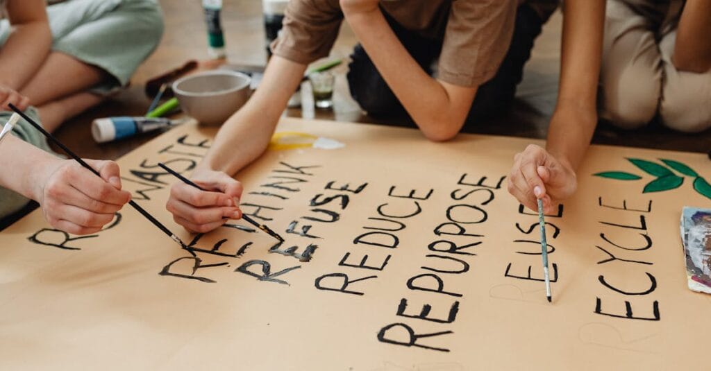 Kids creating a poster on recycling and environmental awareness in an educational setting.