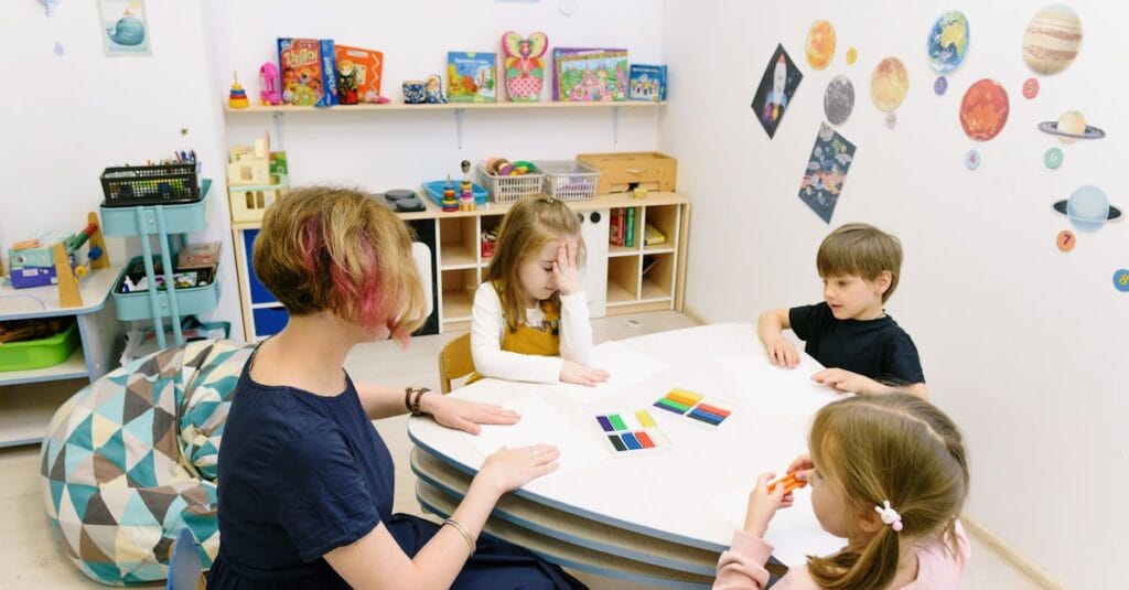 Children engage in a colorful activity with a teacher in a bright kindergarten classroom.