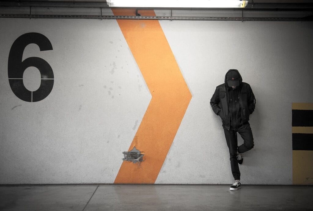 architecture, building, concrete, structure, wall, number, basement, people, guy, man, gray building, gray wall, gray numbers, number, number, number, number, number, people