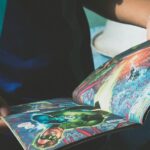 A teenager reading a colorful superhero comic book indoors, enjoying a relaxed moment.