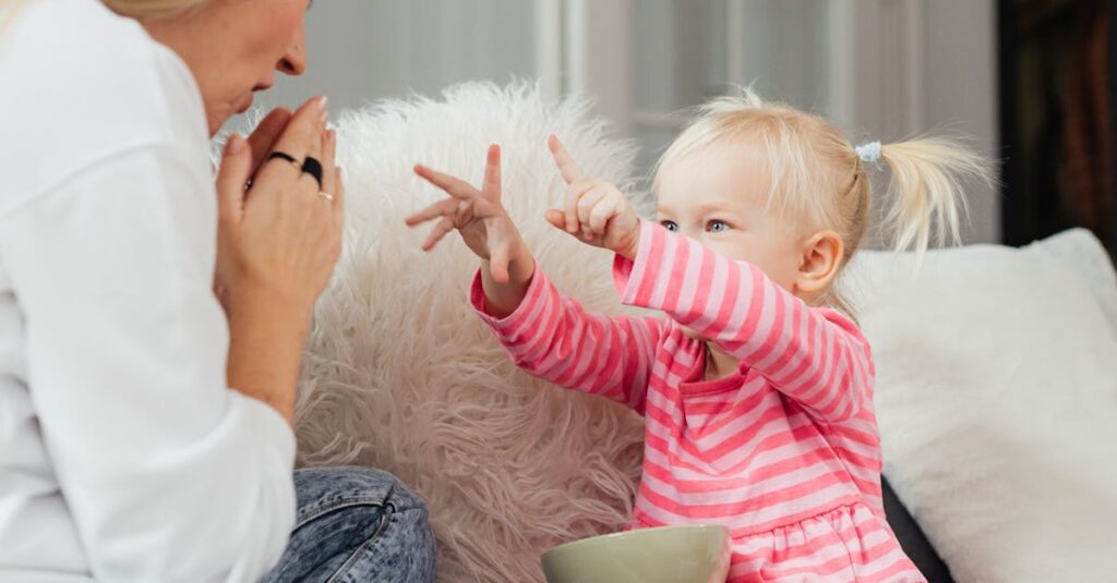 A mother and her daughter share a playful moment in a cozy living room setting.