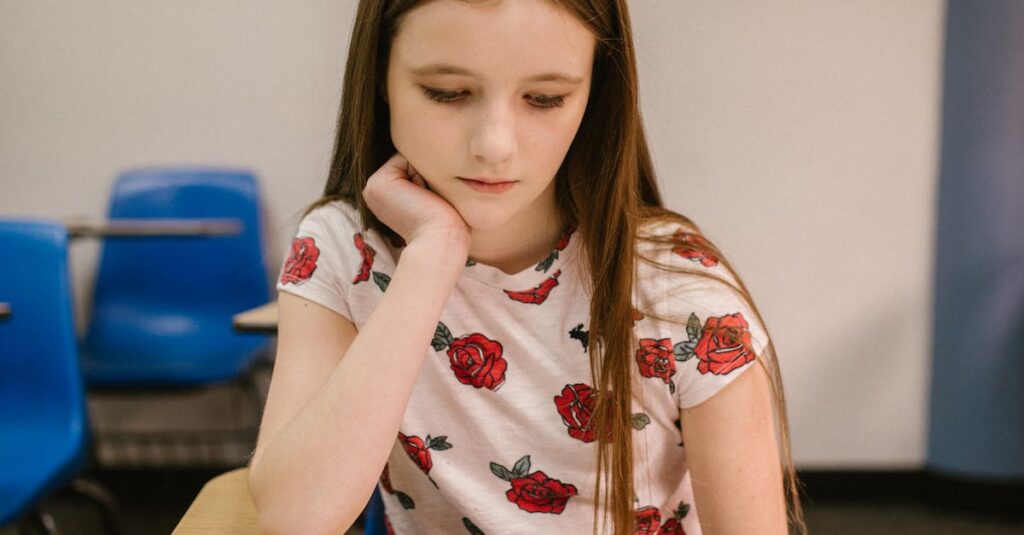 Young girl in a classroom reading a textbook. Focused and contemplative.