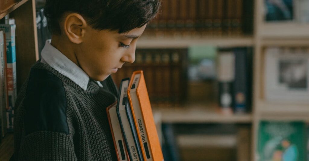 A young boy stands thoughtfully in a library, holding books. Education and solitude concept.