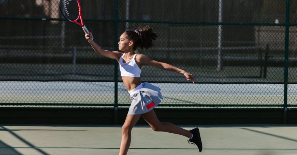 Dynamic shot of a teen girl playing tennis outdoors, showcasing athletic movement and sportswear.