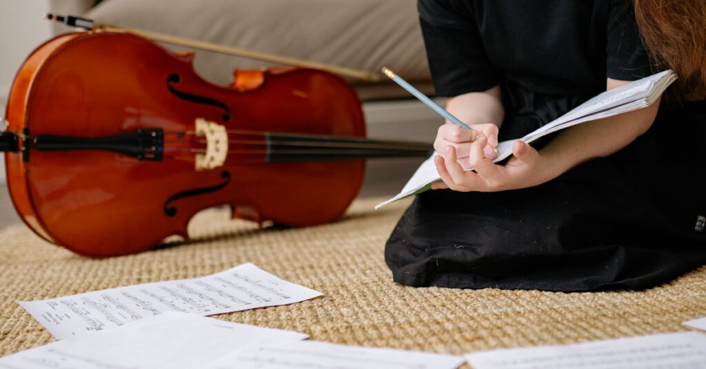 A young girl in a black dress sits on a woven carpet, writing music notes beside her cello in a cozy living room.