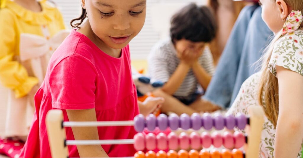 Happy children exploring an abacus in a lively classroom setting.