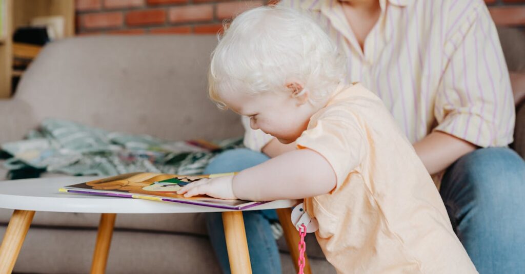 Young child with white hair engaged in reading activity indoors. Perfect for lifestyle visuals.