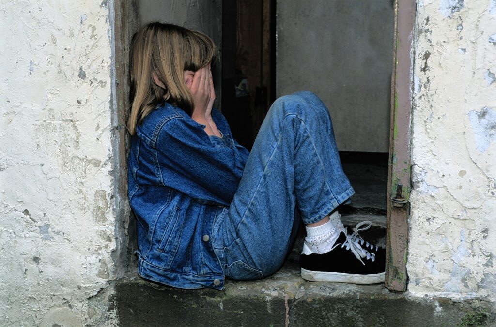 child is sitting, jeans, in the door, cry, sad, lonely, scared, hands on face, cry, scared, scared, scared, scared, scared