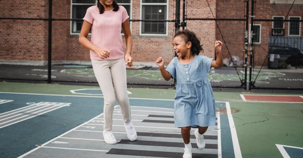 Two young girls happily playing hopscotch on a sunny day in the park.
