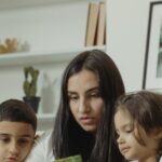 A mom reads to her children in the living room, highlighting bonding and educational moments.