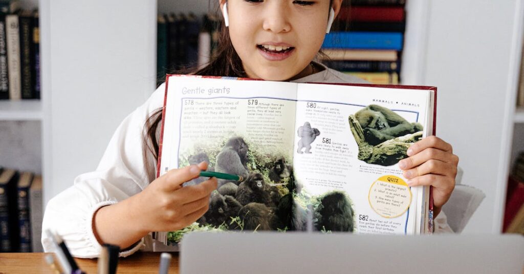 Girl studying online with a laptop and book, illustrating virtual education.