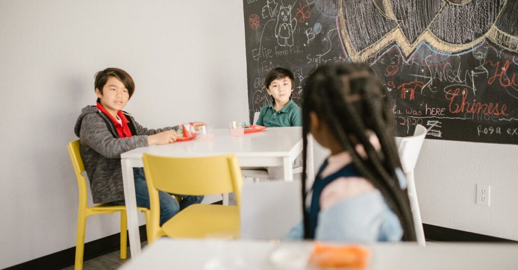 Children sitting in a classroom with snacks and a chalkboard background.