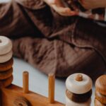 A child engaged in fun learning with a wooden stacking toy and blocks for imaginative play.