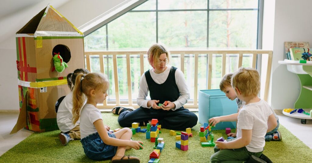 Children enjoying playtime with blocks and cardboard house in a cozy classroom.