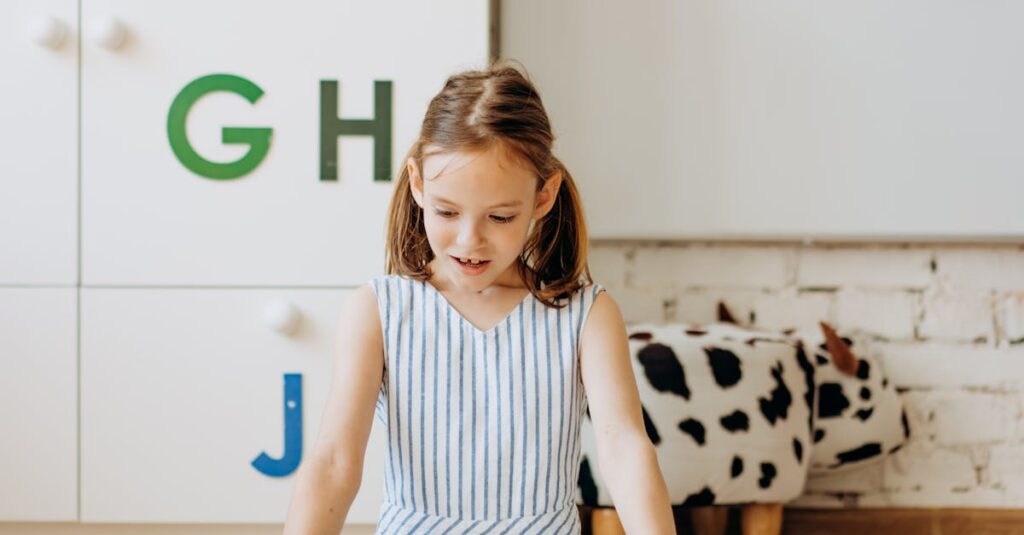 Young girl reading a book surrounded by educational decor indoors.