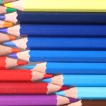 Colorful and organized colored pencils forming a vivid pattern. Perfect for creative projects or artistic inspiration.