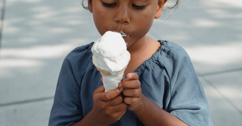A young girl savoring an ice cream cone on a sunny day.