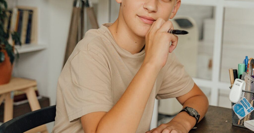 A child with blonde hair pens thoughts in a notebook, appearing thoughtful indoors.