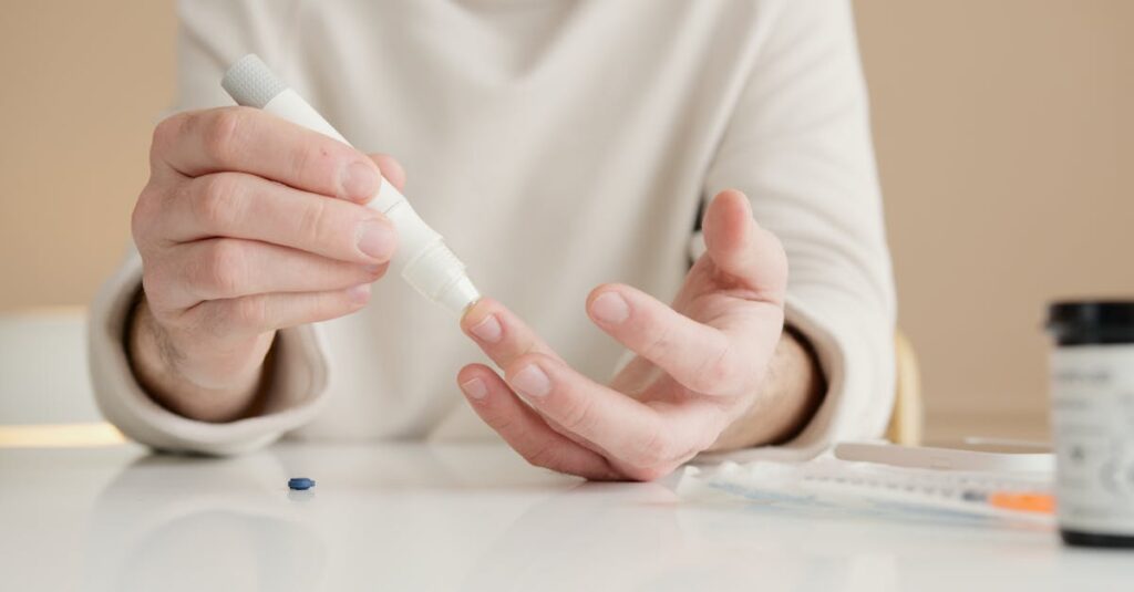 Close-up of a person using a glucometer to test blood sugar at home.
