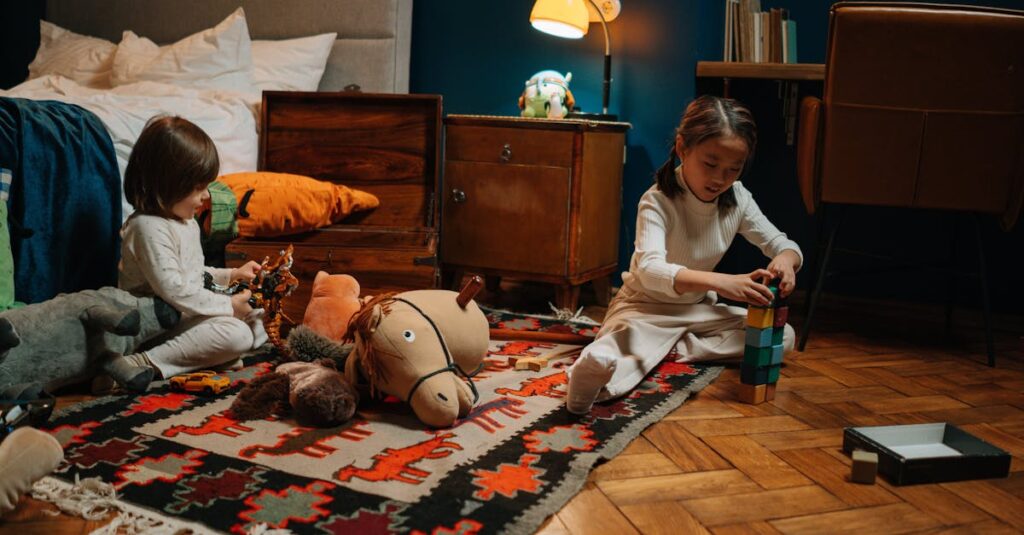 Two children in pajamas play with toys in a warmly lit bedroom, creating a joyful scene.