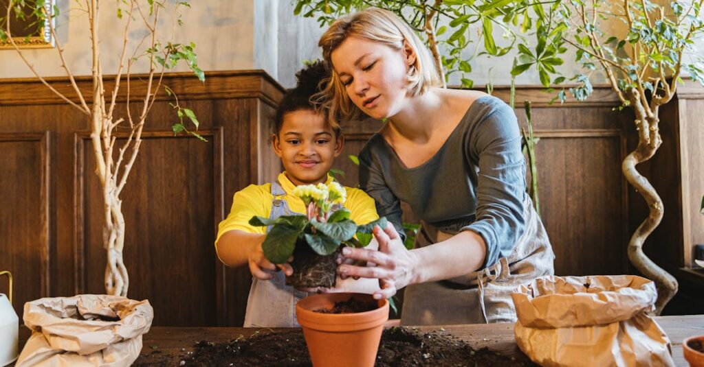 A woman and child enjoy planting a flower together indoors, surrounded by green plants.