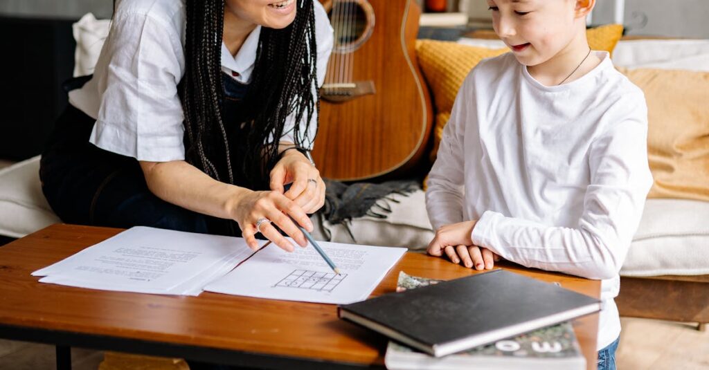 A woman teaching a young boy at a coffee table with papers and books, fostering learning and communication.