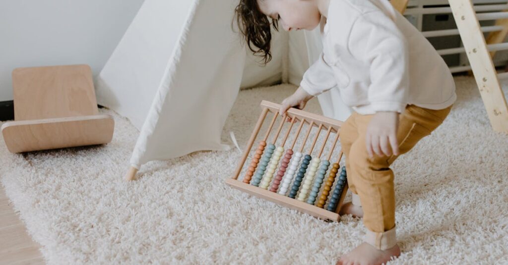 A toddler engaged with an abacus while in a cozy indoor playroom.