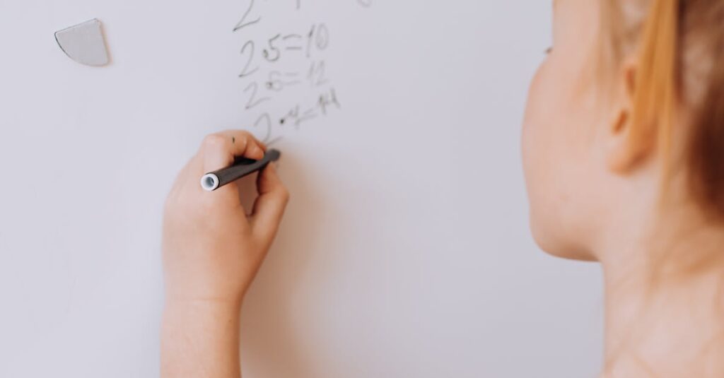 A young girl solving math problems on a whiteboard indoors, showcasing education and learning.